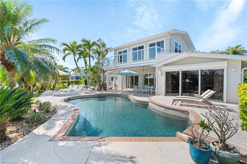 View of pool with a patio and ceiling fan Virtually enhanced image