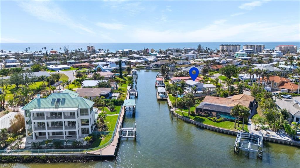 Birds eye view of property with a water view Virtually enhanced image