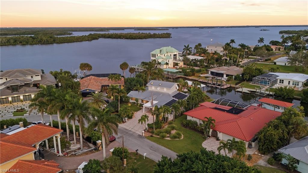 Aerial view at dusk of a residential view and a water view