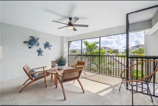 Sunroom with concrete floors and a textured wall