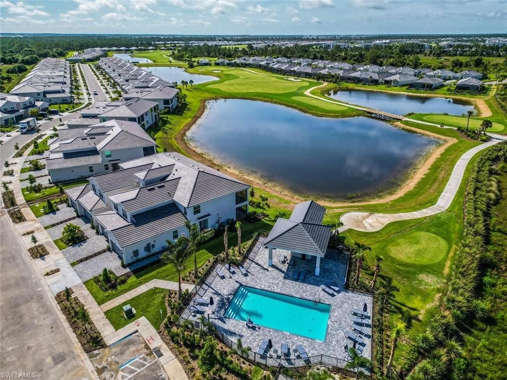 Aerial view of residential area featuring a large body of water