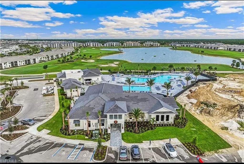 Drone / aerial view of a golf course and a large body of water