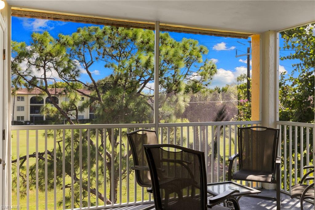 Balcony featuring a sunroom