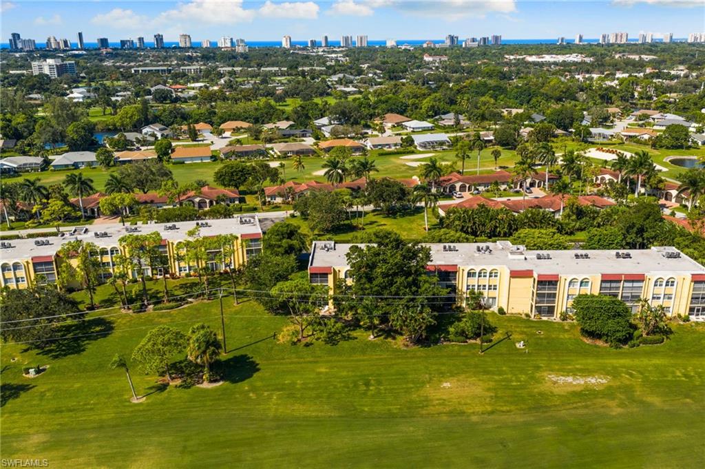 Bird's eye view of city skyline and a local golf course