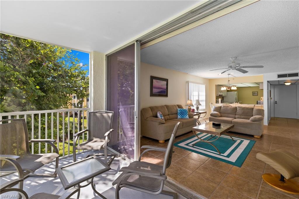 Balcony with a ceiling fan and outdoor lounge area