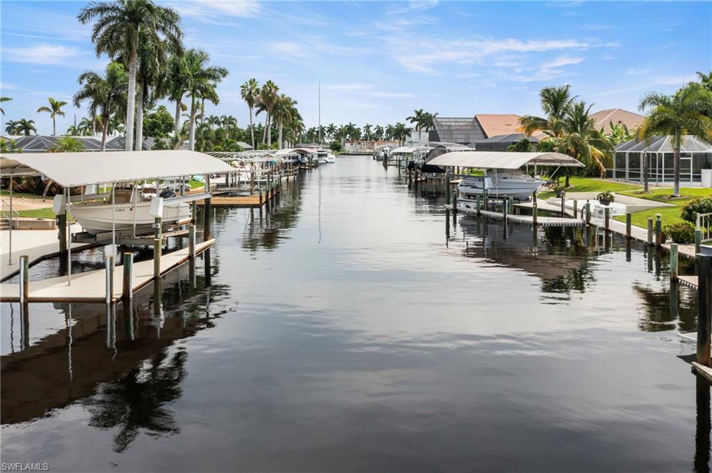 Dock area with a water view and boat lift