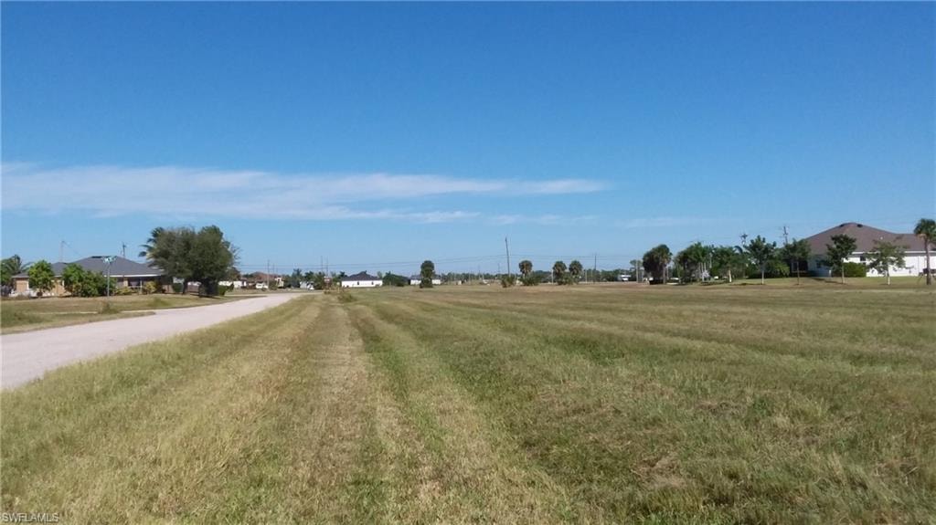 View of asphalt road featuring a rural view