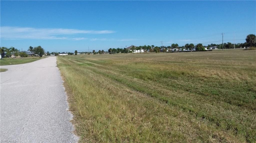 View of asphalt road with a view of countryside