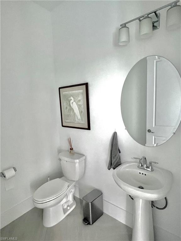 Bathroom featuring toilet and tile patterned floors