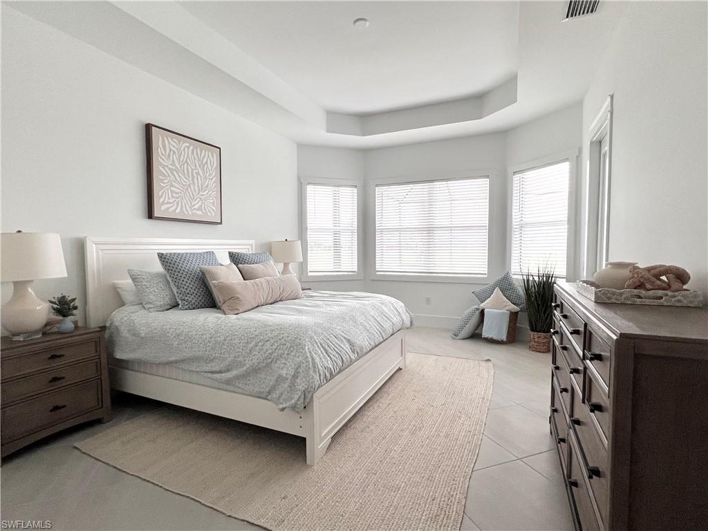 Bedroom with light tile patterned floors