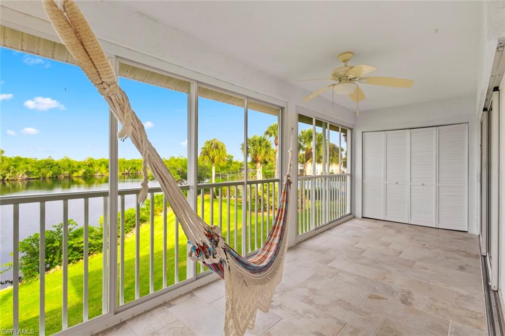 Unfurnished sunroom featuring a water view