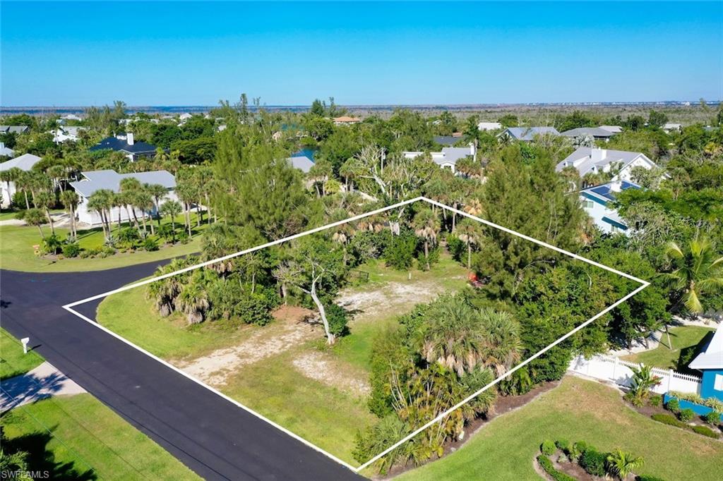 Aerial view of residential area featuring property boundaries highlighted