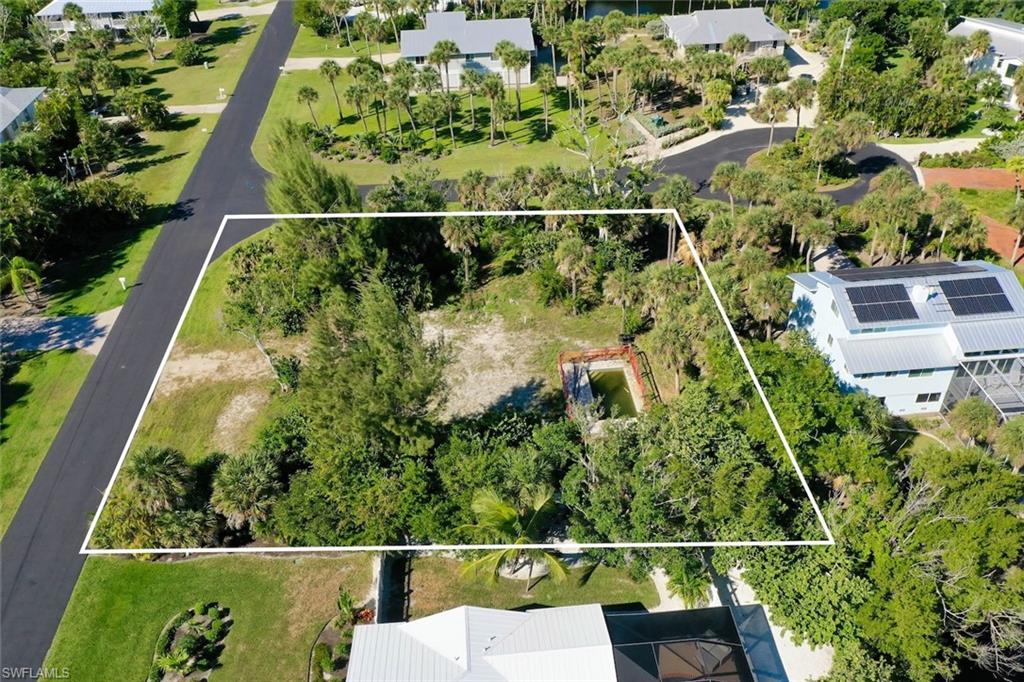 Aerial view of property and surrounding area with property boundaries highlighted