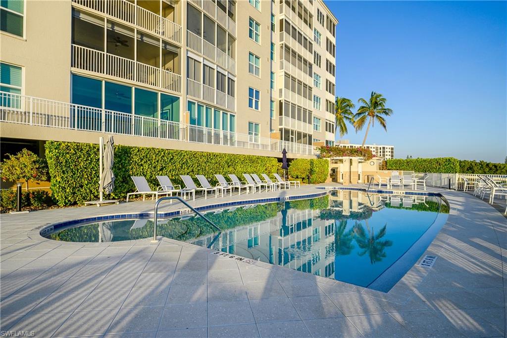 Expansive deck surrounds the waterside pool
