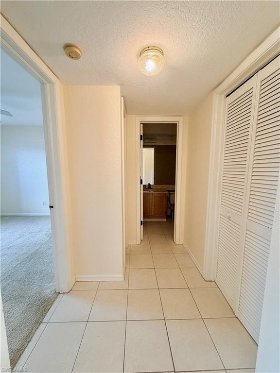 Hallway with light-toned wall paint and white trim