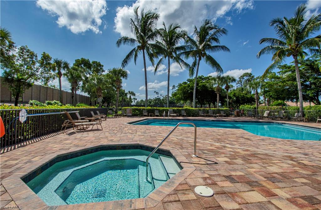 Community pool featuring a patio area and a hot tub