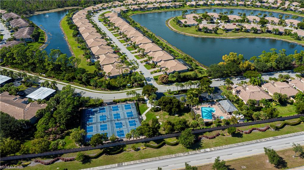 View of property location featuring nearby suburban area and a nearby body of water
