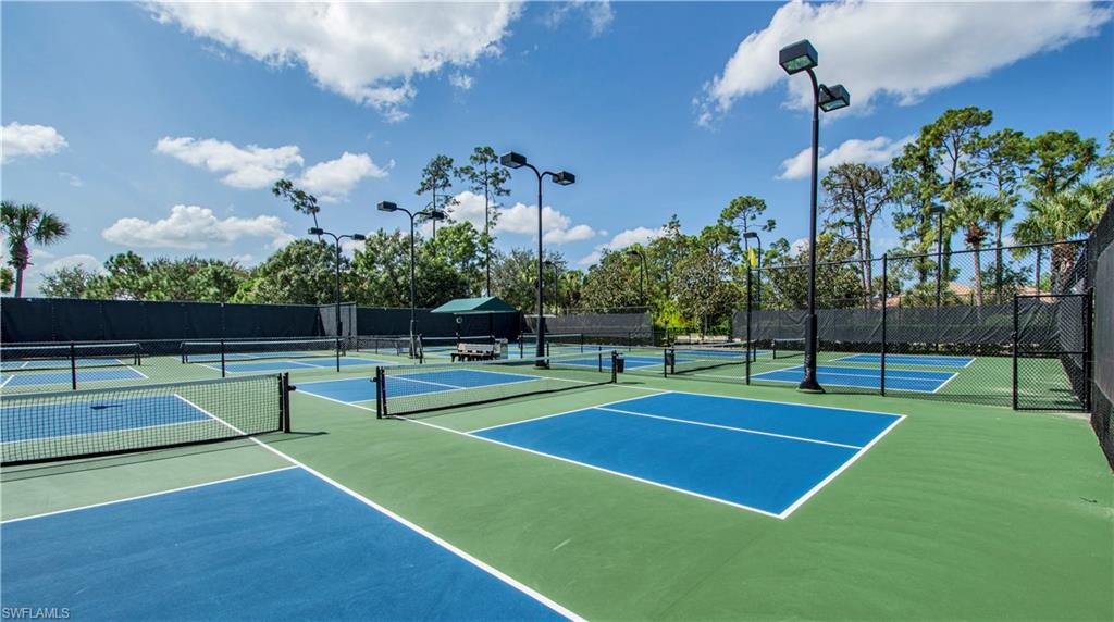 View of tennis court with community basketball court