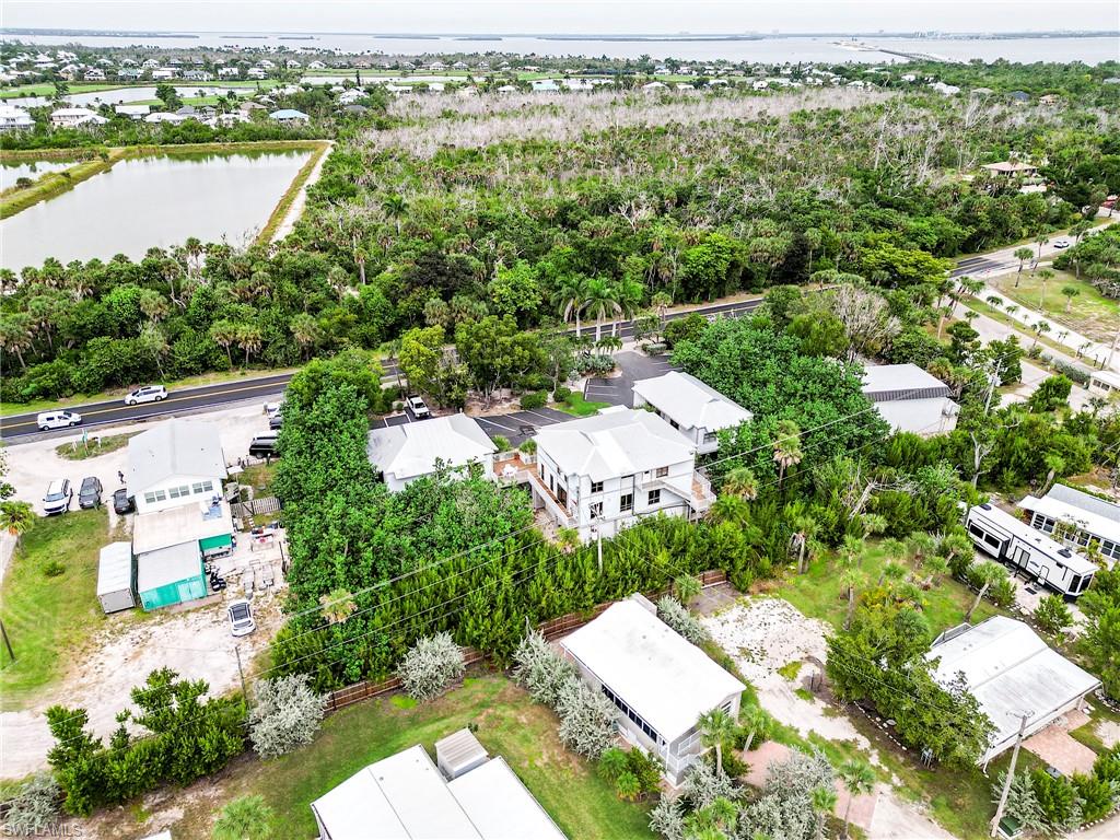 Aerial view of residential area featuring a large body of water