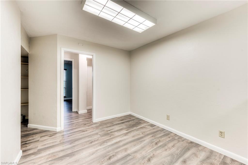 Empty room with light wood finished floors and baseboards