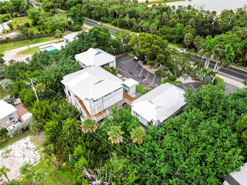 Aerial perspective of suburban area with a tree filled landscape
