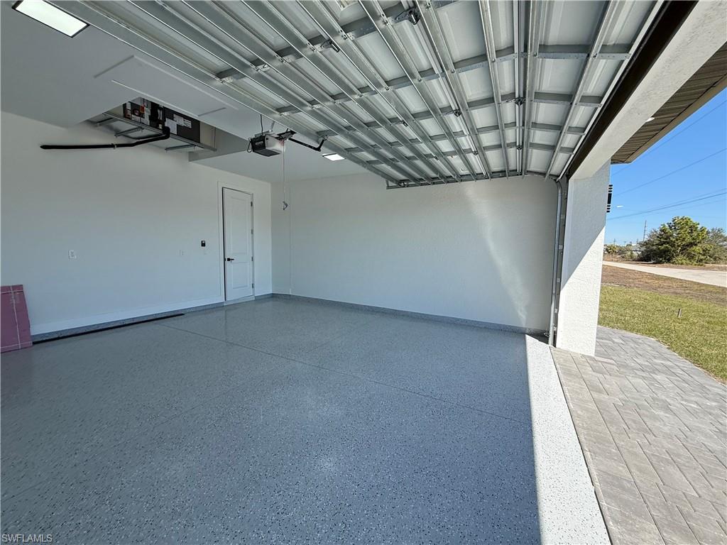 Garage featuring a garage door opener