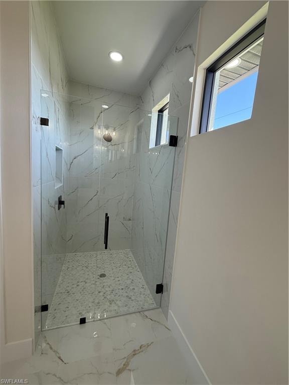 Full bathroom featuring a marble finish shower, marble finish flooring, and recessed lighting