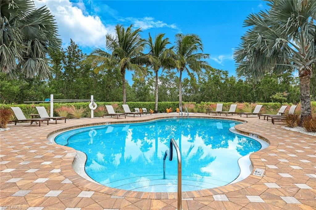 Community pool featuring a patio