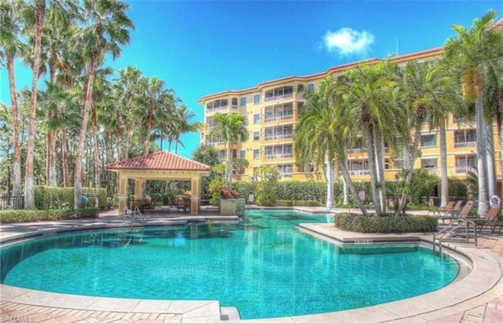 Community pool with a gazebo and a patio