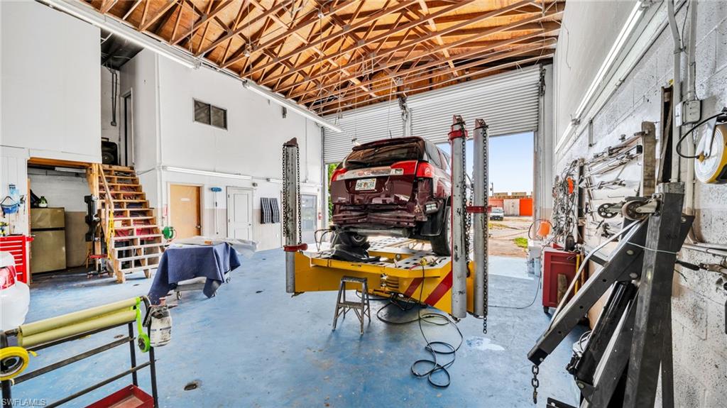 Garage featuring freestanding refrigerator