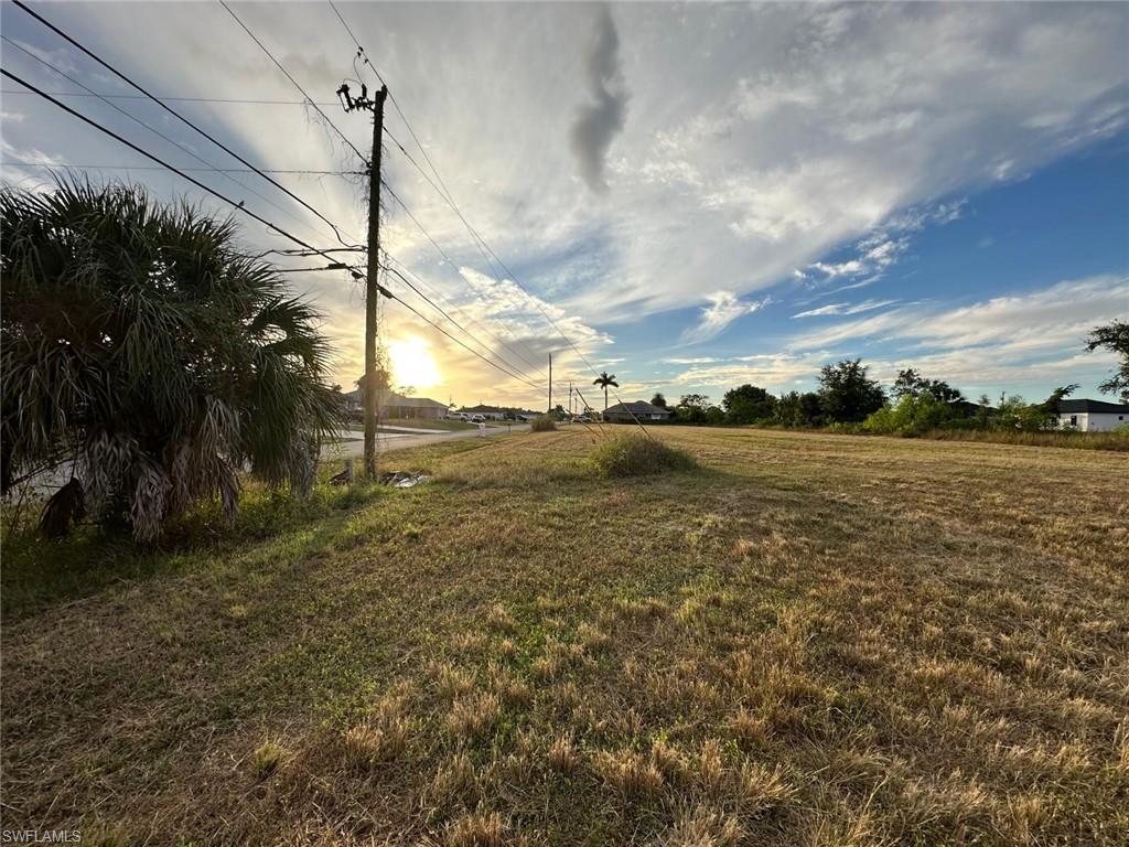 View of grassy yard with a view of countryside