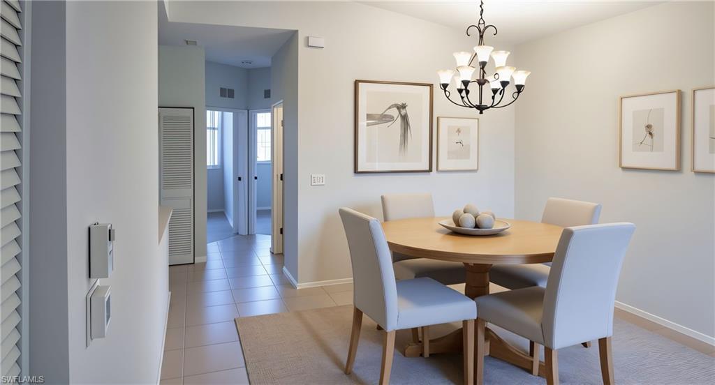 Dining space featuring light tile patterned flooring and a chandelier. virtual staggered