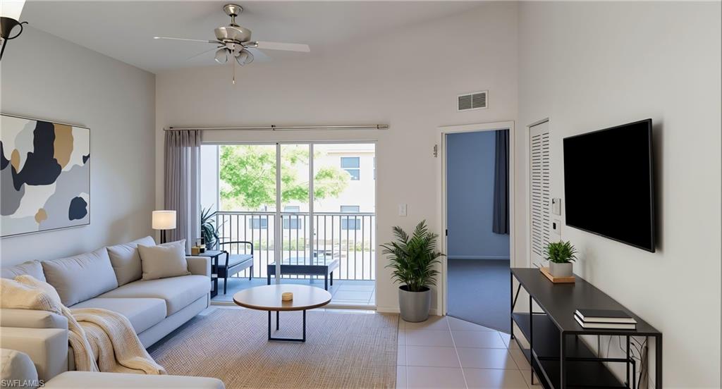 Living room with light tile patterned floors, a high ceiling, and ceiling fan. virtual staggered
