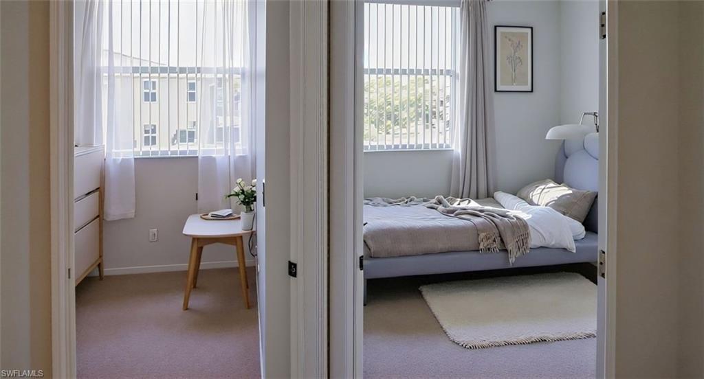 Carpeted bedroom featuring baseboards. virtual staggered