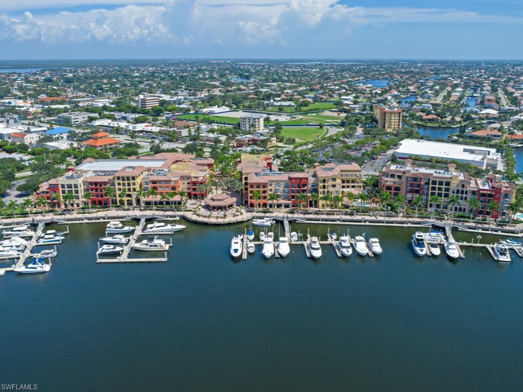 Birds eye view of property with a water view