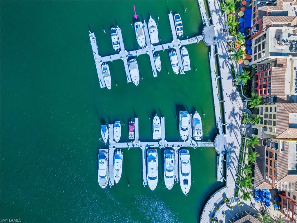 Aerial view of numerous boat docks and a nearby body of water