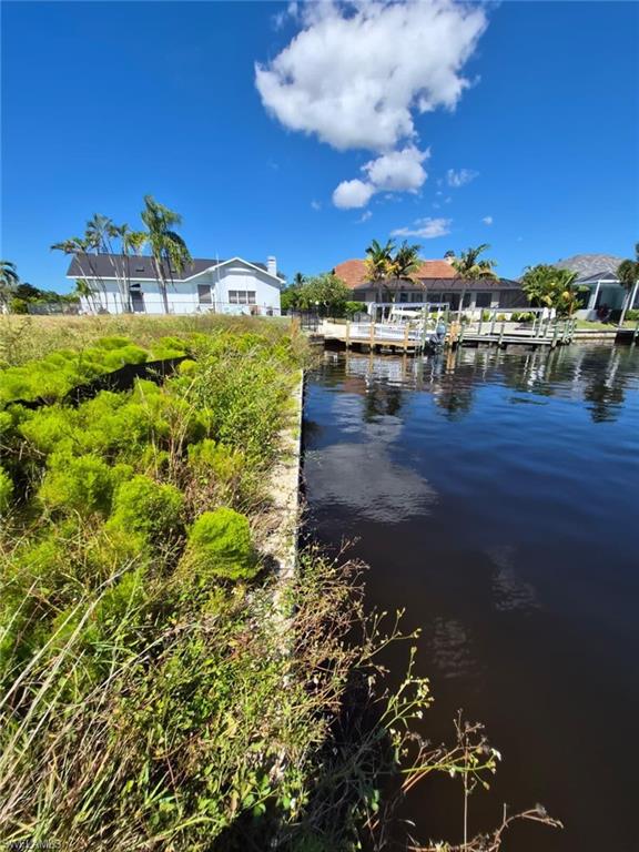 Water view featuring a dock
