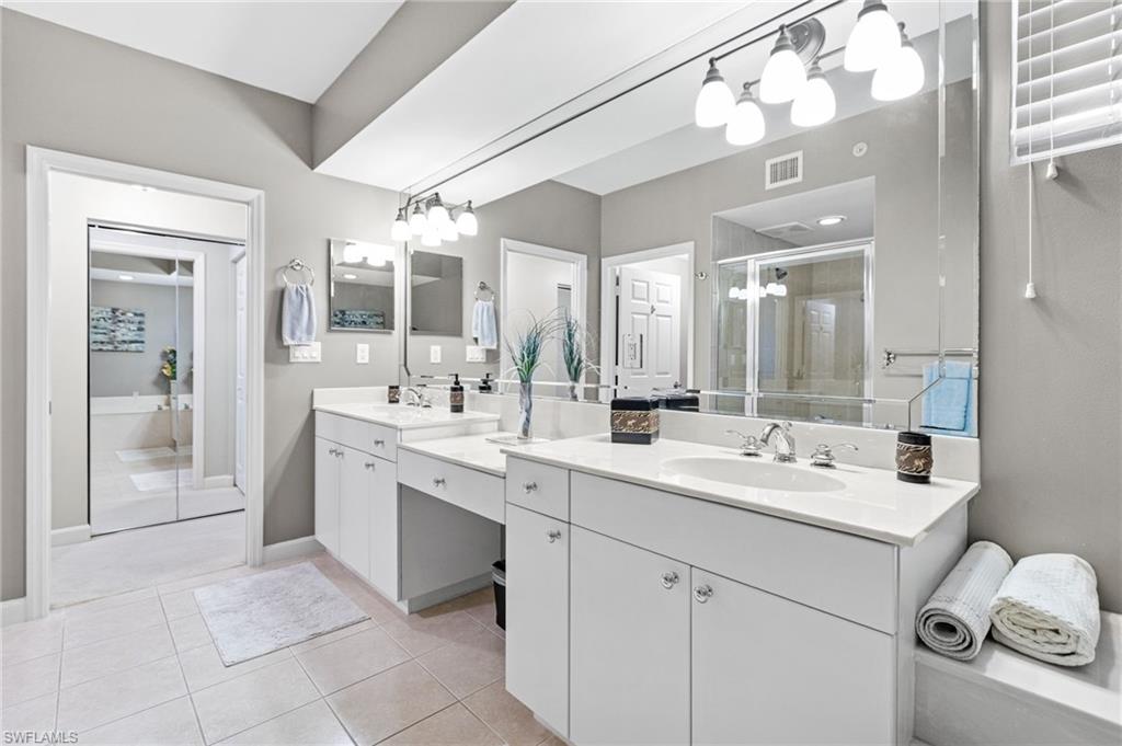 our primary bathroom is thoughtfully designed as a spa-inspired retreat, featuring elegant dual vanities, a dedicated dressing area, and a private water closet. This refined layout blends comfort and functionality, creating a serene space tailored for everyday luxury and ease.