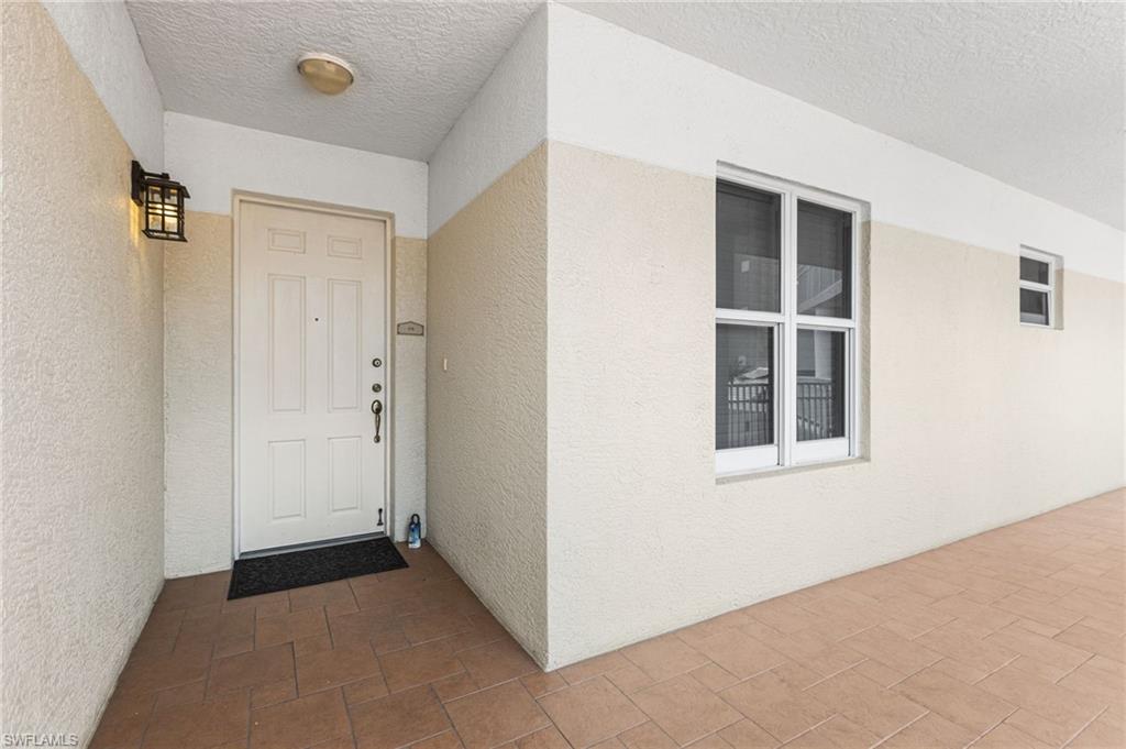 A charming breezeway leads to your front door, creating a graceful and welcoming transition into the home with an airy, inviting sense of arrival.