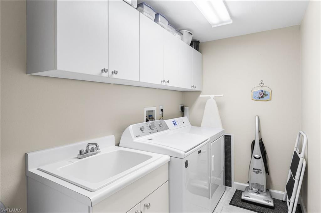 The laundry room offers the added convenience of extra storage, providing a well-organized and functional space for everyday living.