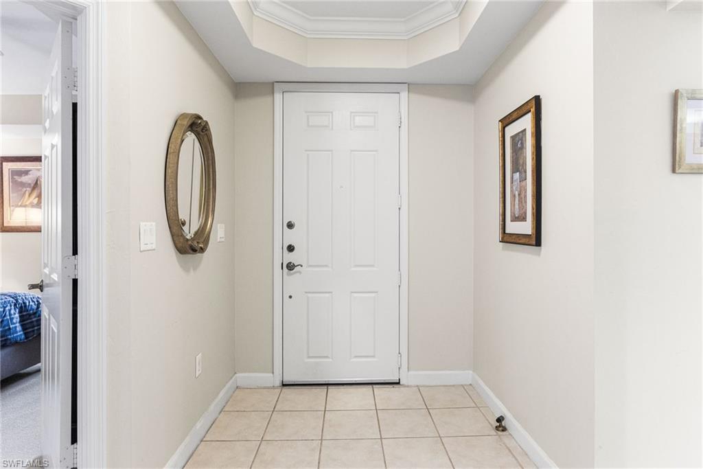 A lovely foyer welcomes you into the residence, highlighted by an elegant tray ceiling at the entrance that sets a refined and inviting tone from the moment you arrive.