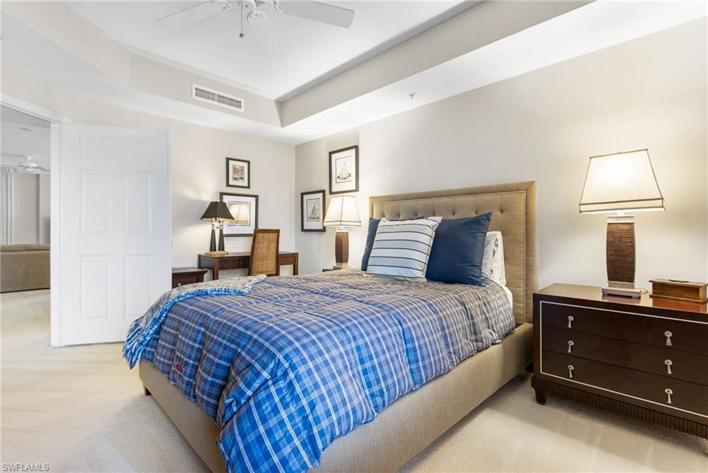 The den is currently utilized as a third bedroom, yet offers exceptional versatility with an effortless transition back to a refined office, private TV room, or intimate den. Elevated by a graceful tray ceiling and elegant double French doors, the space is designed to provide both privacy and sophistication, allowing it to adapt seamlessly to your lifestyle while maintaining a polished, upscale ambiance. Conveniently located just outside the door, the full third bathroom enhances functionality and ease for