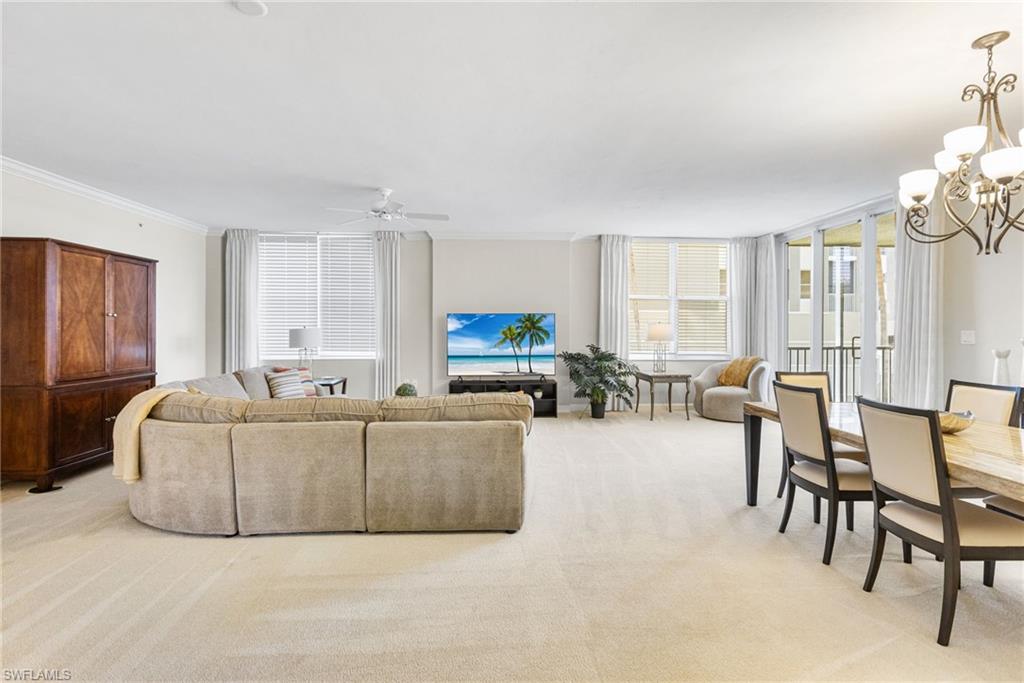 Abundant natural light pours into the expansive main living area, creating a bright and airy ambiance throughout. From here, you are seamlessly connected to the lanai, where sweeping views of the river provide a serene and picturesque backdrop for everyday living and effortless entertaining.