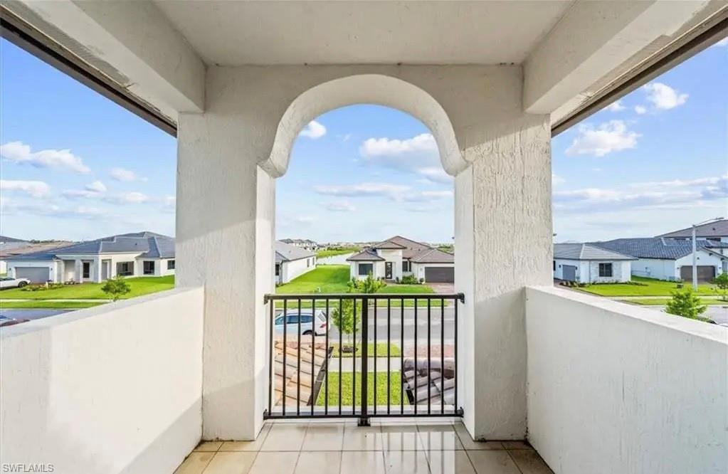 Balcony featuring a residential view