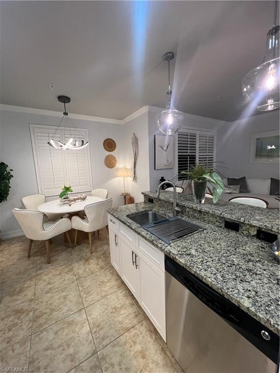 Kitchen featuring hanging light fixtures, white cabinets, light stone counters, dishwashing machine, and ornamental molding