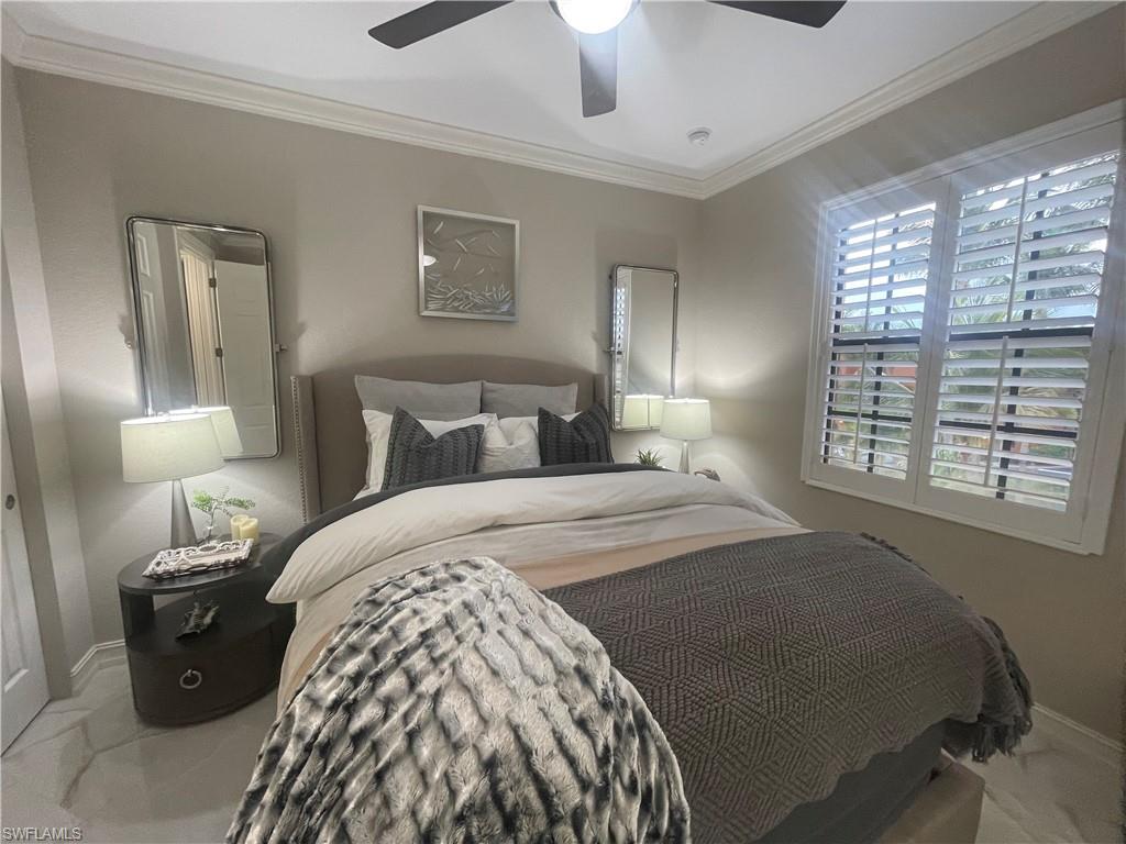 Bedroom featuring crown molding and ceiling fan