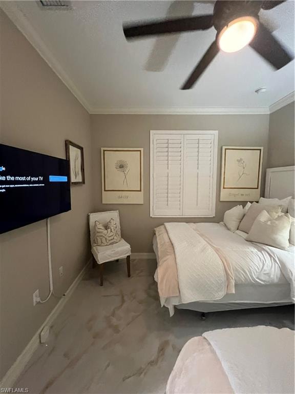 Carpeted bedroom featuring ornamental molding and ceiling fan
