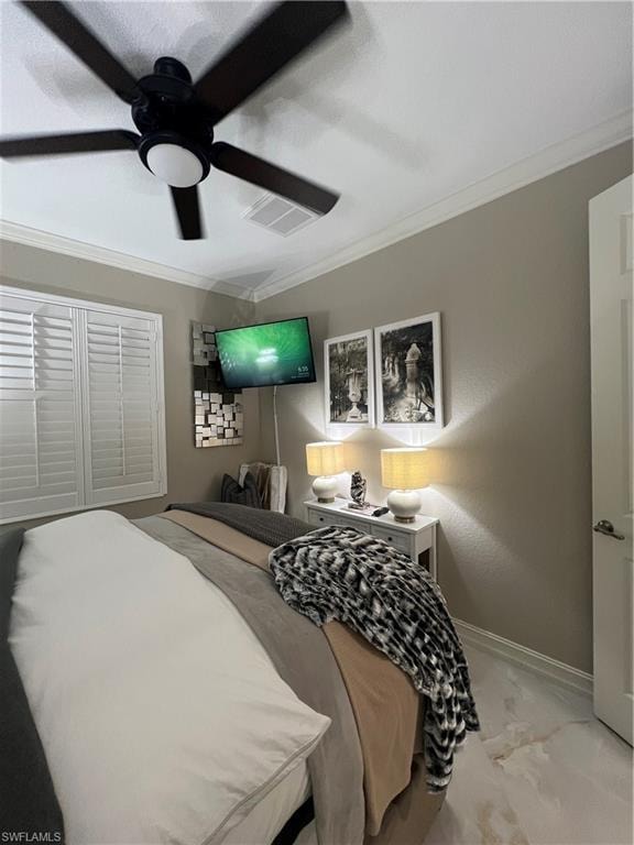 Carpeted bedroom with ornamental molding and ceiling fan