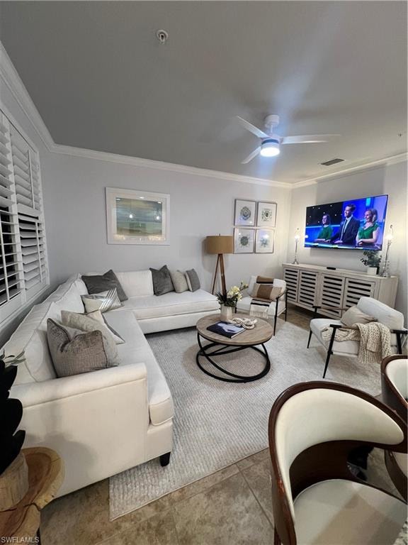 Living area featuring ornamental molding and ceiling fan