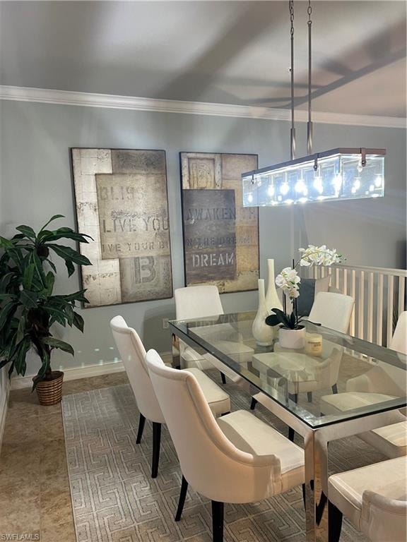 Dining area with ornamental molding